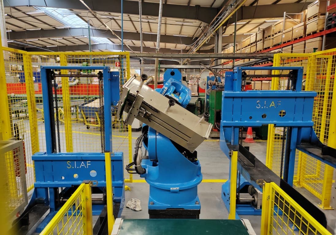 Custom end-of-arm tooling for product and carton handling.